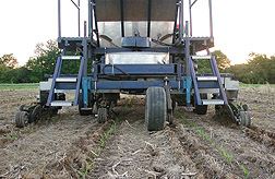 Photo: A new machine that buries poultry litter in shallow trenches in fields to provide fertilizer but control runoff of excess nutrients. Link to photo information