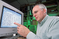 Geneticist examines results from genetic analyses of sires: Click here for full photo caption.