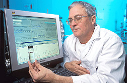 Microbiologist analyzes water sample for chemicals: Click here for full photo caption.