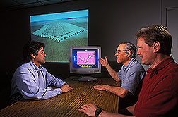 Soil scientist, chemist, and LABEX coordinator discuss use of data for soil analyses: Click here for full photo caption.