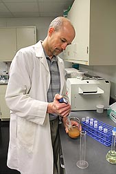 Hydrologist Carl Bolster prepares a soil sample to determine soil phosphorus concentration, an important input parameter to the APLE model: Click here for photo caption.