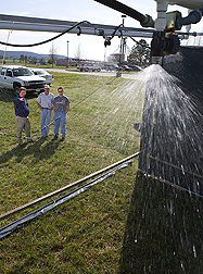 ARS and University of Arkansas scientists conduct rainfall simulation experiments that provided phosphorus runoff loss data used to develop and test the APLE computer model: Click here for photo caption.