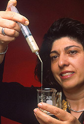 Chemist tests a soy-based polymer slurry: Click here for full photo caption.