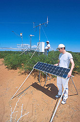 Two scientists measure thermal and moisture flux: Click here for full photo caption.