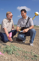 Plant physiologist and technician locate seed bank samples with GPS coordinates: Click here for full photo caption.