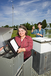 Chemists use air and rain sample collection devices to study the fate of atmospheric pollutants in the Chesapeake Bay region: Click here for full photo caption.