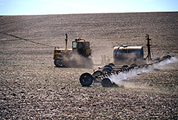 Herbicides are applied to a field to kill off weeds. Click here for full photo caption.