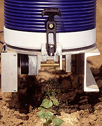 Tractor mounted Mite Meter dispenses up to 20,000 biocontrol mites per acre.