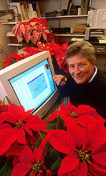 Entomologist displaying the computer software she developed: Click here for full photo caption.