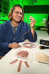 Chemist displays different samples of electroactive bioplastics: Click here for full photo caption.