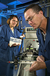Research leader and chemist examine extruded electroactive bioplastic: Click here for full photo caption.