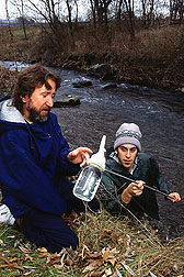 Soil scientist and technician collect a water sample from a Pennsylvania stream: Click here for full photo caption.