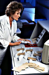 Technician inserts cotton samples into an Advanced Fiber Information System.
