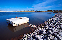 A step baffle trash rack on the spillway inlet of Boomer Lake prevents floating debris from plugging the inlet. Click here for full photo caption.