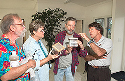 Entomologist points out differences between oriental and melon fruit flies during a workshop: Click here for full photo caption.