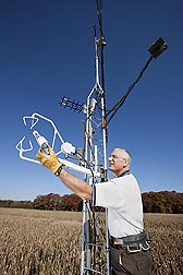 Hydrologist Bill Kustas checks the position of a water vapor/CO2 sensor on a micrometeorological tower: Click here for full photo caption.