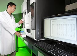 In studies of the relation of maternal obesity to fetal bone development, principal investigator Jin-Ran Chen uses a next-generation DNA sequencer to investigate changes in gene methylation: Click here for photo caption.