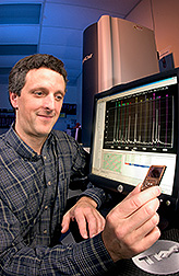 Geneticist holding a chip: Click here for full photo caption.