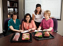 Nutrient Data Laboratory scientists review the revised USDA nutrient data sets for fresh pork and beef: Click here for full photo caption.
