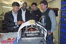 At the Western Regional Research Center in Albany, California, research team members test prototype infrared peeling equipment: Click here for full photo caption.