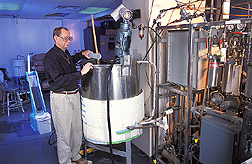Chemical engineer prepares to test fermentability of corn: Click here for full photo caption.
