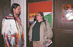 Champion grass dancer talks with postdoctoral fellow about American Indian health study: Click here for full photo caption.