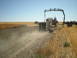 Near Ritzville, Washington, scientists use a wind tunnel to measure wind erosion of soil particles from a recently planted wheat field: Click here for photo caption.