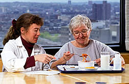 Dietitian Jackie Charnley discusses the protein study with a volunteer. Click here for full photo caption.