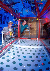 Two entomologists set up a flight tunnel experiment in a laboratory: Click here for full photo caption.