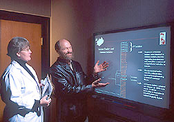 Research leader and biologist analyze dendograms: Click here for full photo caption.