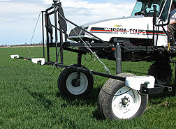 Light reflectance sensors mounted on the front of an applicator are used to measure nitrogen deficiency: Click here for full photo caption.