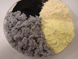 Clockwise from lower left: cellulose fiber, spray-dried bovine blood, spray-dried egg, and a milk substitute: Click here for full photo caption.