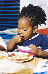 ARS research suggests a link between a youngster’s body mass index, or BMI, and the feeding styles of the child’s parents and other caregivers: Click here for photo caption.