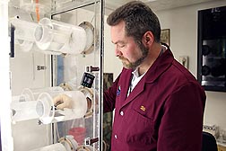 In Gainesville, Florida, ARS chemist Uli Bernier uses an olfactometer to evaluate the efficacy of a chemical to inhibit mosquitoes from being attracted to humans: Click here for photo caption.