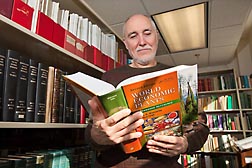 At the ARS Germplasm Resources Information Network (GRIN) taxonomy botany library in Beltsville, Maryland, botanist John Wiersema reviews the new edition of "World Economic Plants: A Standard Reference," which he coauthored: Click here for photo caption.