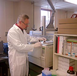 Physiologist Matthew Picklo performs fatty acid analysis of a sample of human blood plasma to determine the effects of salmon consumption: Click here for full photo caption.