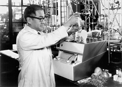 WRRC scientist Roy Teranishi samples the headspace over fresh grapes just before injecting a sample into a gas chromatograph. (1963): Click here for photo caption.