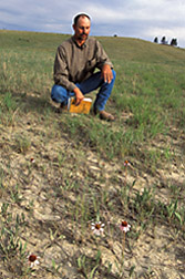 Extension agent assesses rangeland health: Click here for full photo caption.