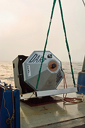 A tsunami buoy is launched into the ocean from a National Oceanic and Atmospheric Administration ship: Click here for photo caption.