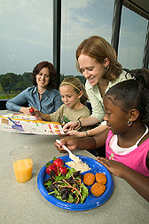 Dietitians explain nutritional information to visiting students: Click here for full photo caption.