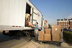 (From left) Driver for Agricultural Chemicals Development Services, Inc., physical scientist, and coordinator of the ARS IR-4 program, unload frozen sweetpotato, cabbage, peach, and coriander samples from IR-4 field trials in Tennessee, California, Colorado, and Texas: Click here for full photo caption.