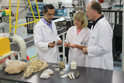 In Brazil, ARS plant physiologist Greg Glenn (right) and ARS botanist De Wood (center) inspect composite materials that contain plant fiber with Luiz Mattoso, director of the EMBRAPA Agricultural Instrumentation Center in Sao Carlos: Click here for full photo caption. 