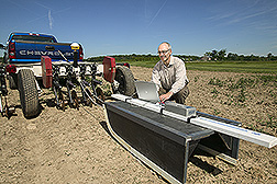 Technician begins a geophysical data collection sequence: Click here for full photo caption.