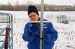 Agroecologist changes ammonia tubes on a cold winter's day: Click here for full photo caption.