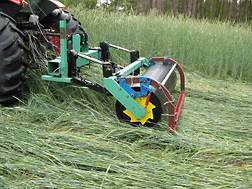 Agricultural engineer and his colleagues compared three different roller designs. This roller has a smooth drum attached to a crimping bar to smash the rye down as the machine moves forward: Click here for full photo caption.