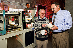 Using an injection molder, chemists and the director of research for the Washington, D.C.-based Horticultural Research Institute produce biodegradable flowerpots from chicken feathers: Click here for full photo caption.