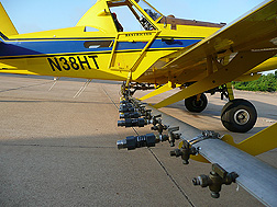 An aircraft fitted with Bete NF70 nozzles, which were shown in the lab to produce the optimum droplet size for oil dispersants: Click here for full photo caption.