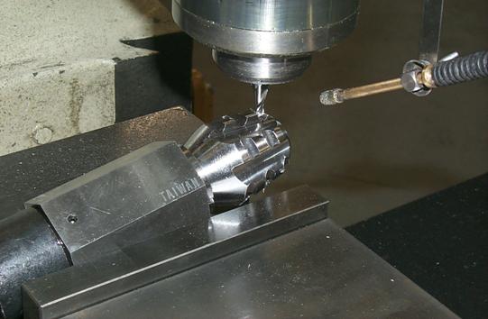 Flutes and gullets being manually milled on soil coring bit