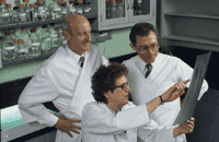 Scientists reviewing sequence data in the late 1980's. 