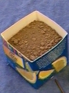 Image of a soil sample in half of an orange juice container